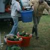 Julie and son lugging heavy produce