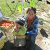 Mom with a happy customer eating his apple. 